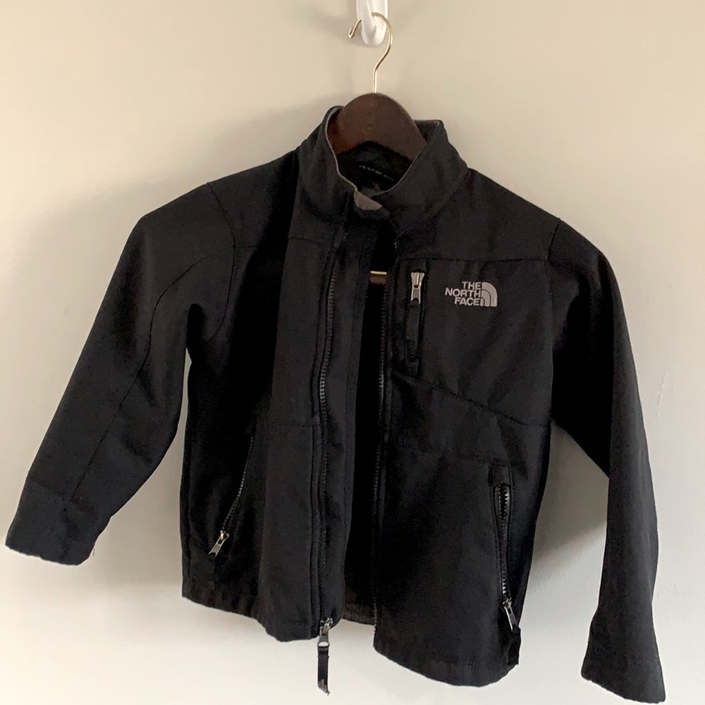 Black North Face soft shell jacket. Kids size 6.